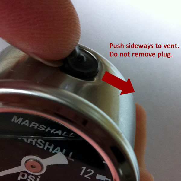 Venting a liquid filled gauge to equalize case pressure Venting a liquid filled gauge to equalize case pressure.